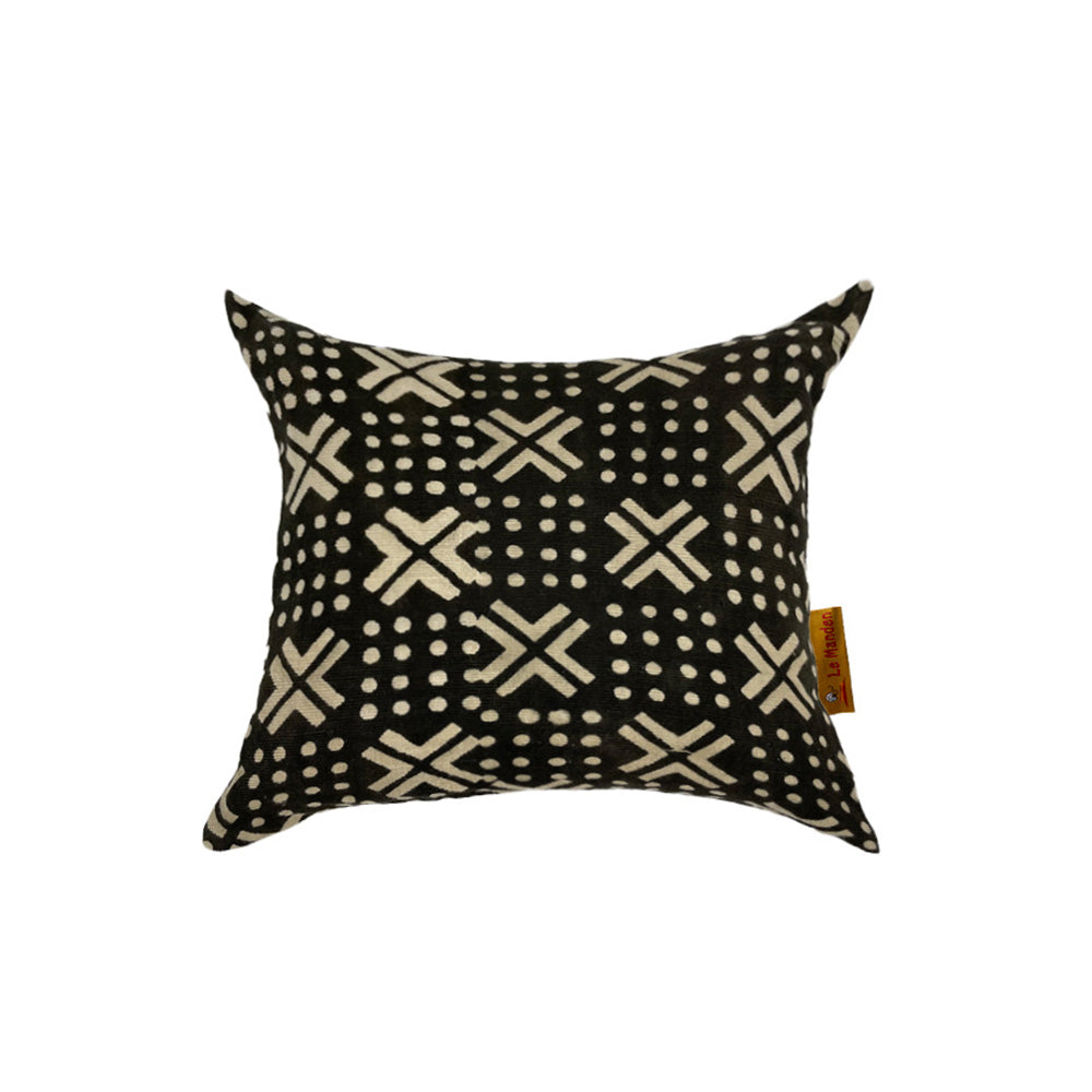 Black cushion with cross patterns and dots on a white background
